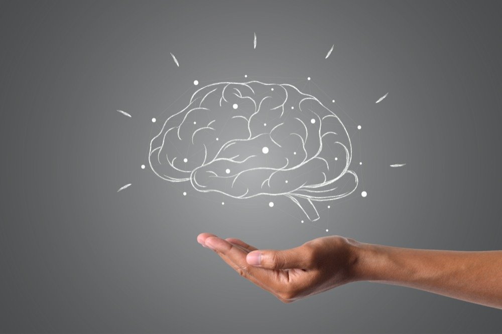 Cerveau dessiné en fil de fer blanc sur fond gris